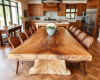 An extra-long 400cm bookmatched dining tabletop, seating 14 people and featuring a stunning symmetrical grain pattern down the center.