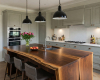 A luxury traditional kitchen's centerpiece is a solid oak island with a thick wood top and butterfly key joinery.