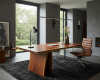 A handcrafted live edge suar wood desk creates a warm, organic focal point in this minimalist luxury office.