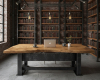 A luxury industrial library's focus is a heavy-duty desk with a thick, one-of-a-kind solid suar slab top.