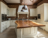 A luxury country kitchen's centerpiece is a unique split-top live edge island with a suar wood worktop.