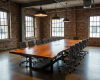 A colossal, 16-seater live edge boardroom tabletop from an out-of-scale slab with an integrated central tech channel.