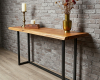 A minimalist live edge console tabletop with a light, blonde wood tone, a smooth satin finish, and a subtle, natural contour.