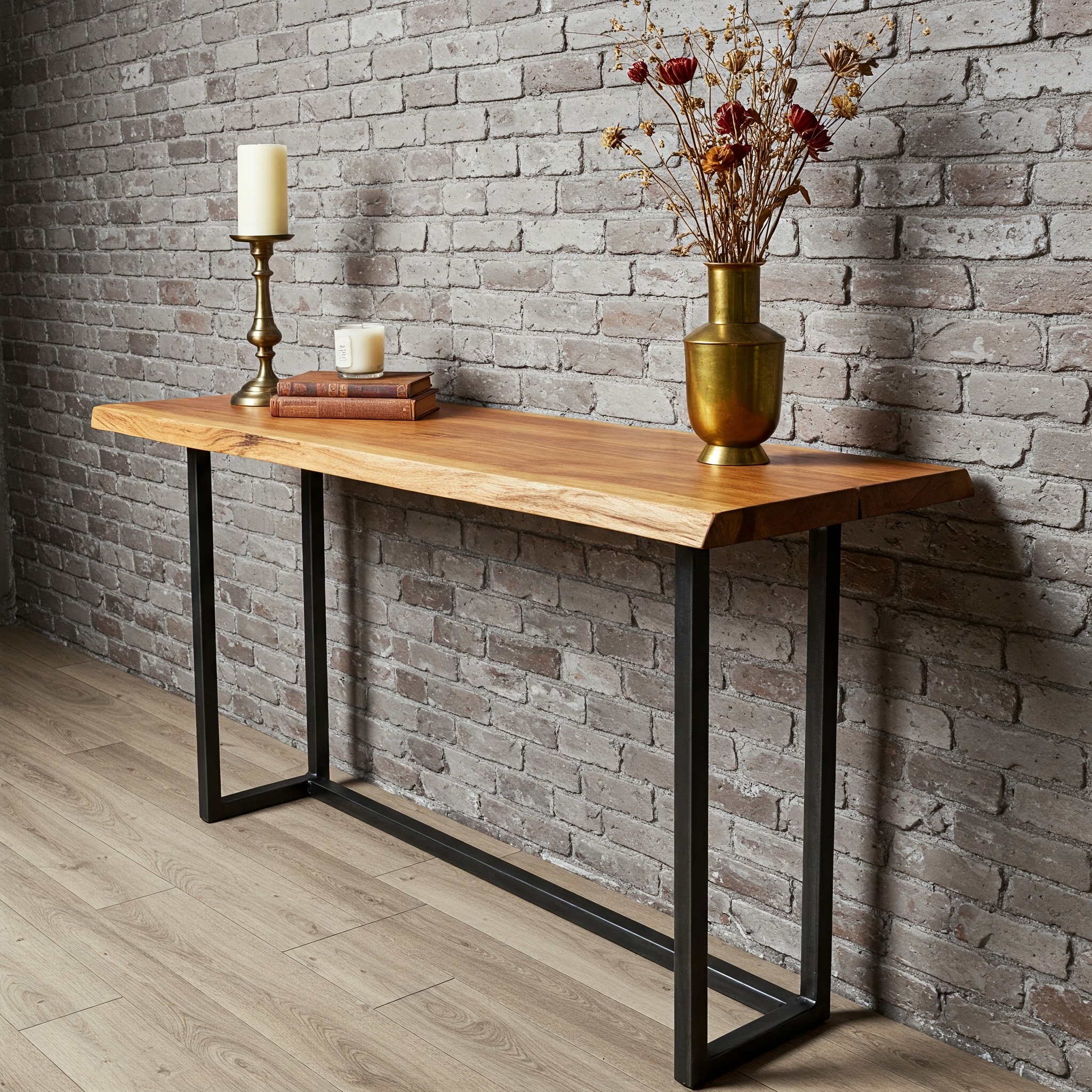 A minimalist live edge console tabletop with a light, blonde wood tone, a smooth satin finish, and a subtle, natural contour.