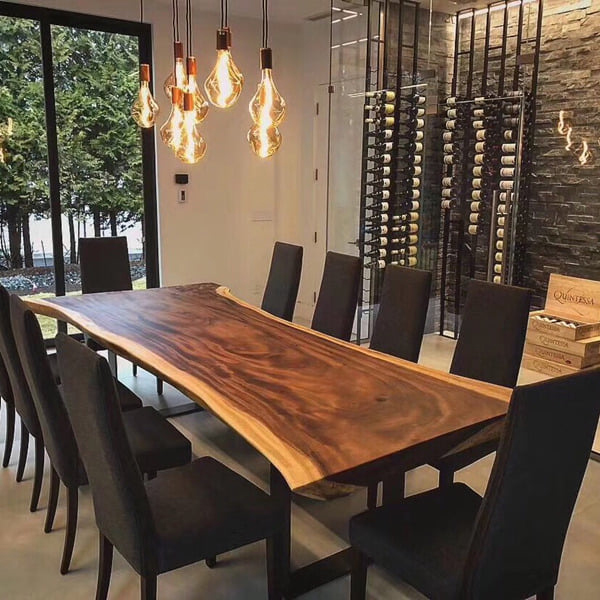An elegant 10-seater live edge dining tabletop with a dramatic contrast wood grain, featuring a gracefully undulating natural edge.