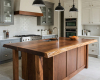 A handcrafted suar wood live edge island with a prep sink is the highlight of this elegant, two-tone kitchen.