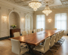 A unicorn-grade, 14-seater live edge boardroom tabletop of suar wood with two discreet technology integration ports.