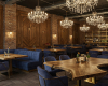 An ultra-luxury boutique restaurant's atmosphere is set by its freeform live edge tables and wood paneling.