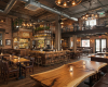 A unique, multi-level industrial pub, consistently furnished with bespoke live edge suar wood bar and tables.